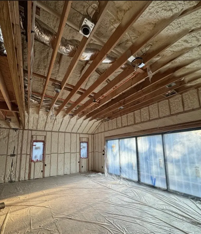 Interior walls and ceiling insulated with spray foam during new construction in Chapel Hill